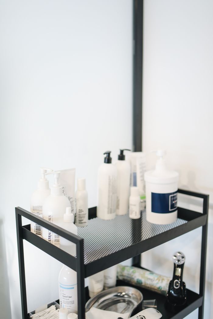 Organized beauty products on a salon cart with a clean, minimalist look.