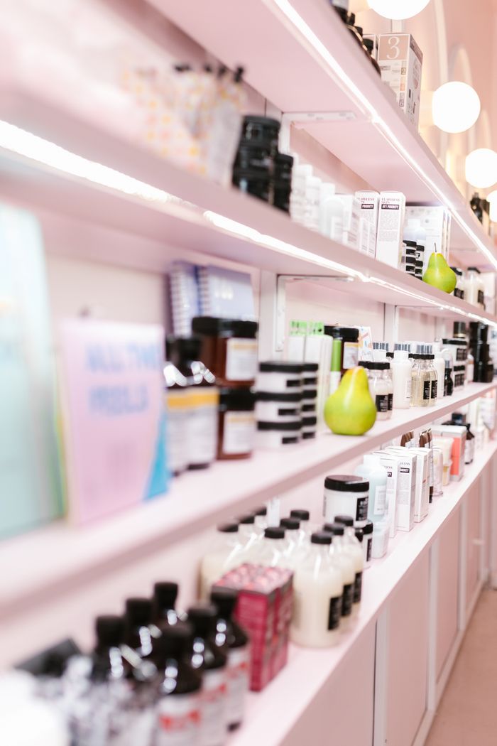 A stylish display of various hair care products in a contemporary salon setting.